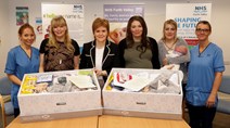 Baby Boxes Begin: First Minister gifts first Baby Boxes to expectant parents.