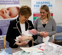 Baby Boxes Begin: First Minister gifts first Baby Boxes to expectant parents.