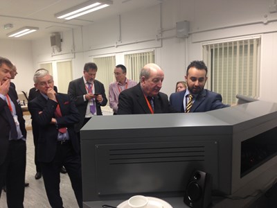 Lord Berkeley using the Hitachi ETCS driving simulator watched by Martin Vickers