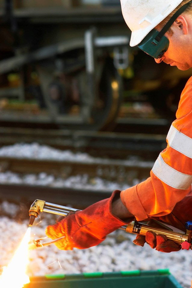 NETWORK RAIL ENGINEERS HARD AT WORK OVER CHRISTMAS TO UPGRADE BRITAIN'S RAILWAYS: Welder at work