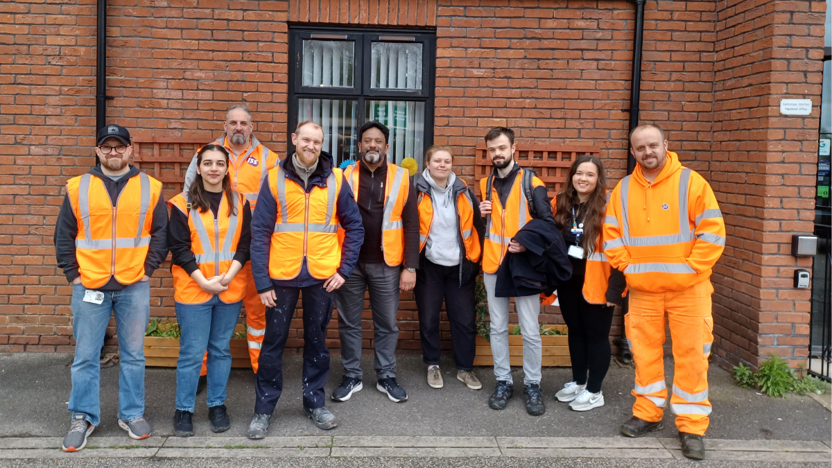 An image of volunteers working to improve Burley Park Station