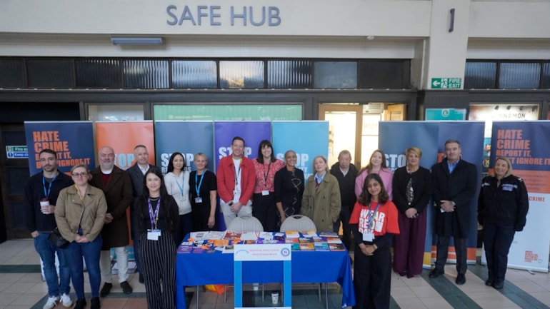 Train commuters engaged in conversations on hate crime