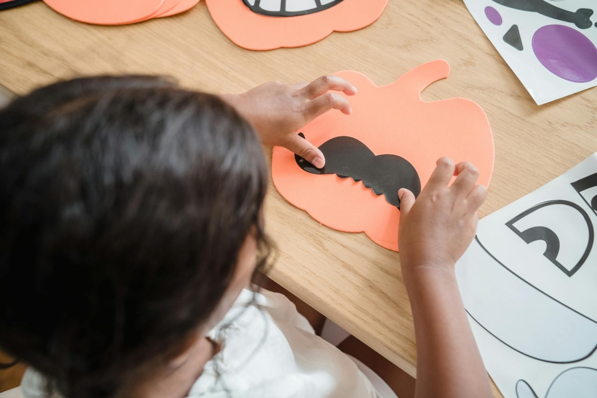 Child doing Halloween craft