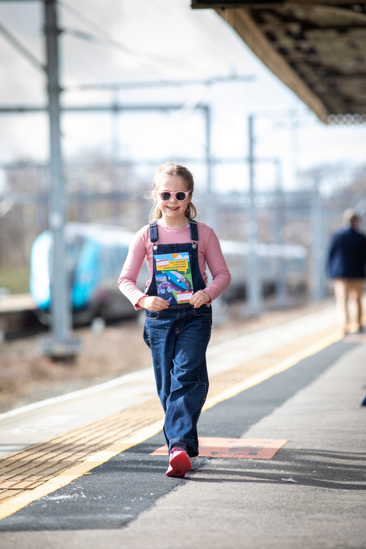 Ivy, 7, at the station with her new TPE activity book