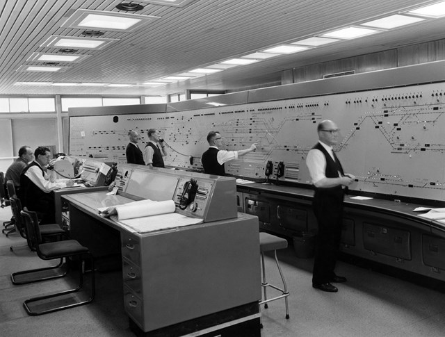 Birmingham New Street signal box, Circa 1966 The interior of New Street signal box. Operators are working on route-setting panel and central control desk. CREDIT KIDDERMINSTER RAILWAY MUSEUM
