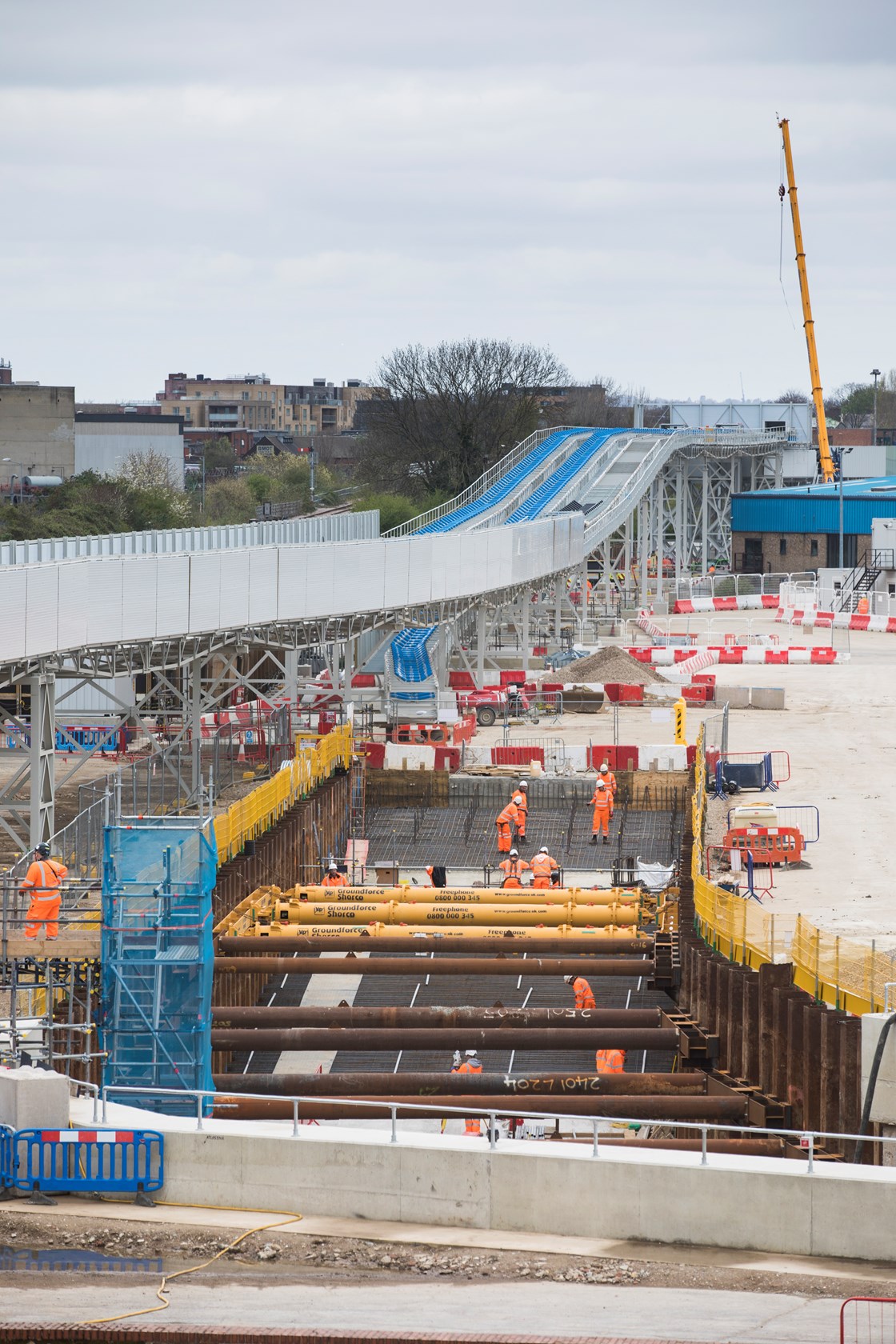 West London spoil conveyor network - Atlas Road spur: The conveyor network has three spurs, serving the Old Oak Common station site, the Victoria Road Crossover box site, and the Atlas Road site. At Atlas Road, the conveyor will be used to remove spoil from the excavation of a logistics tunnel running from Atlas Road to Old Oak Common. The conveyor will then be extended through the logistics tunnel and will remove material from excavation of the Euston tunnel, further reducing the impact on the local road network. 

Image from April 2022 during construction of the  conveyor network. 

Tags: Construction, Conveyor, Spoil, Tunneling, SCS JV, Environment