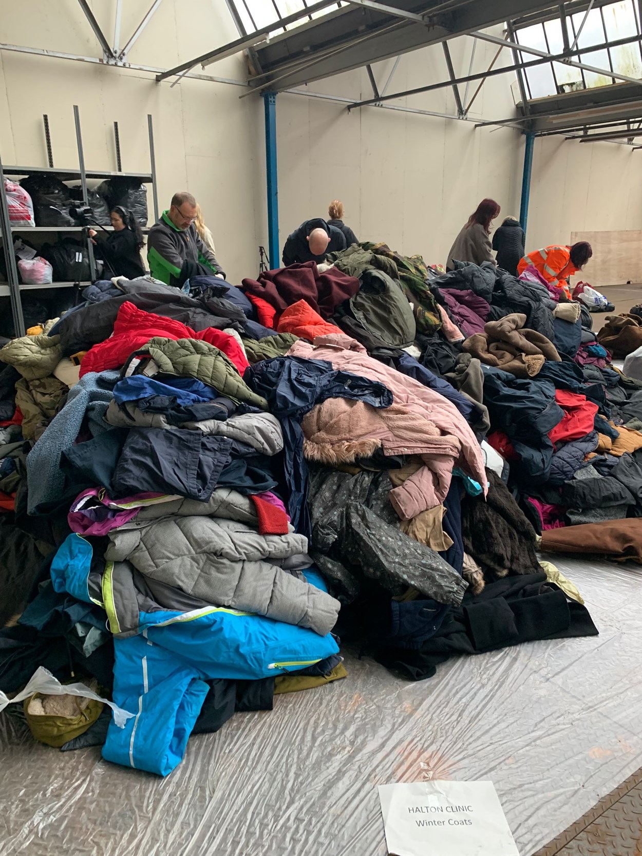 Coat appeal: Volunteers help sort some of the thousands of coats donated to the appeal
