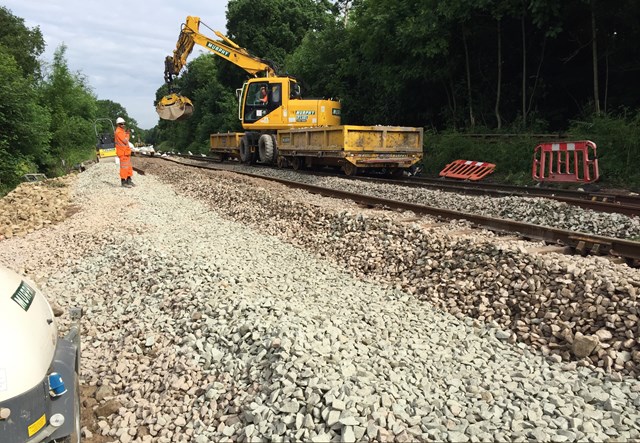 Railway between Manchester and Buxton expected to reopen this weekend: A Road Rail Vehicle working on the site of the landslip at Middlewood-2