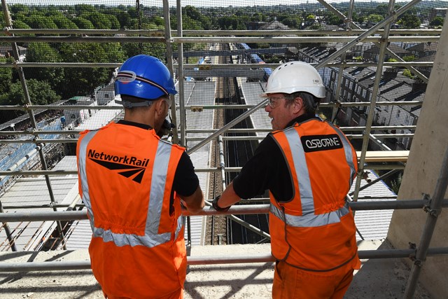 Network Rail and Osborne engineers on worksite above railway