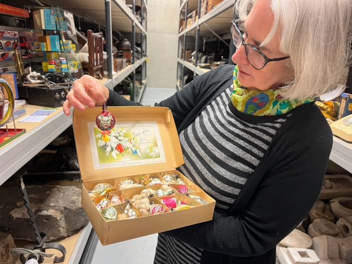 Biscuit messages: Also part of the collection is a set of Mickey Mouse Christmas tree lights as well as some brightly coloured glass baubles manufactured by Morley’s Briteglass Ltd. The Jay-Tee brand glass Christmas tree decorations were owned by local couple Herbert and Maud Storer who married in 1944.