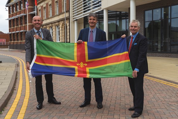 Government announces devolution proposal for Greater Lincolnshire: Council leaders with Lincolnshire Flag
