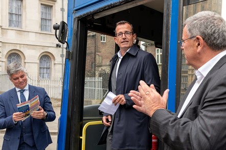 Christian Schreyer, Chief Executive of The Go-Ahead Group, presents a bus converted into a field hospital to the Ukrainian ambassador.