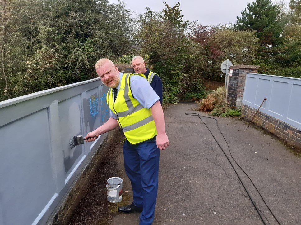 Cllr Damian Corfield with the street scene team removing graffitti