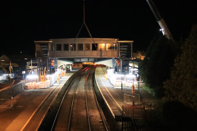 Bridge span is installed at Llanelli station as part of construction of accessible footbridge