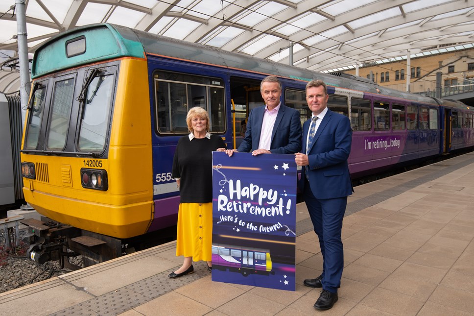 SAYING GOODBYE: (r-l) Northern MD David Brown, Transport Focus Director David Sidebottom and Cllr Doreen Dickinson, Vice Chair of TfGMC present 142005 a card to celebrate its retirement.