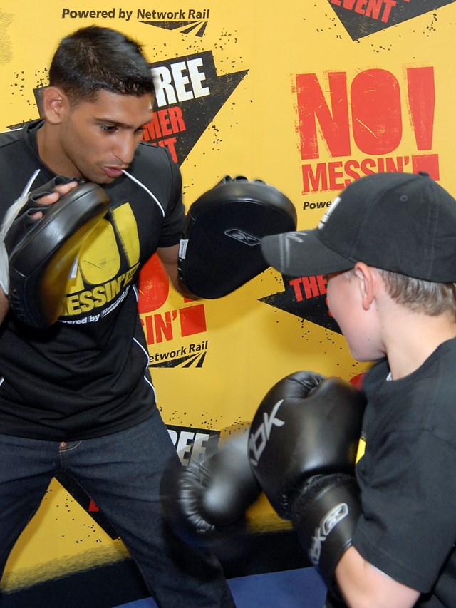 Amir Khan spars with youngster at Gloves