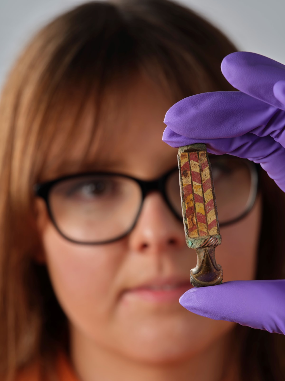 Assistant Curator Bethany Simpson with the Pathhead brooch. Image © National Museums Scotland-4