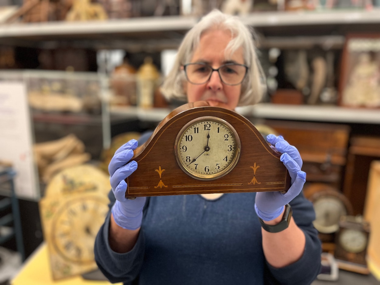 Clocks workshop: Curator Kitty Ross with a 19th century carriage clock.
Among the pieces featured in the event will be an elaborate painted clock faces by Leeds artisans J C Elliott and G Winter, who both had local workshops in the late 19th Century, when many such small, family-run workshops would have been located in big cities like Leeds.
An intricate early 20th Century Swiss-made wooden cuckoo clock and some classic examples of 19th and 20th Century carriage clocks are also included. They will be shown alongside a more modern, 1970s Minitman digital bedside alarm clock.