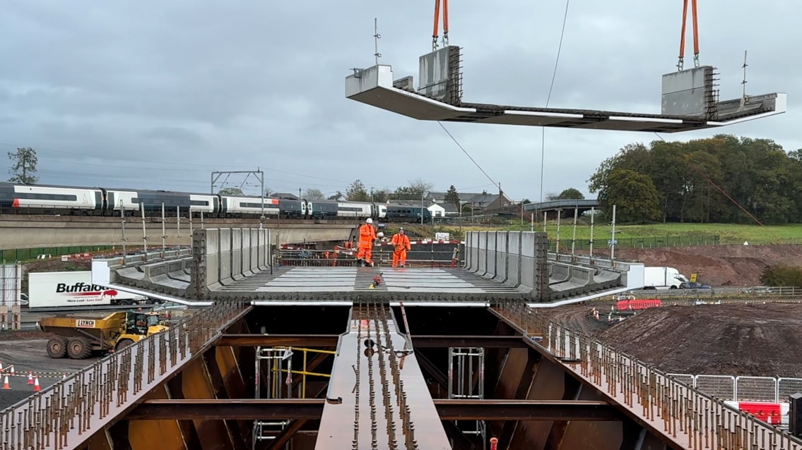 Time-lapse shows huge railway bridge construction ahead of M6 renewal: Old bridge from new Clifton bridge with M6 and Avanti train in the background copy