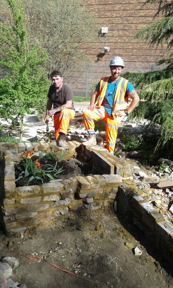 Bricklaying: Thameslink staff bricklaying in the Crossbones Garden