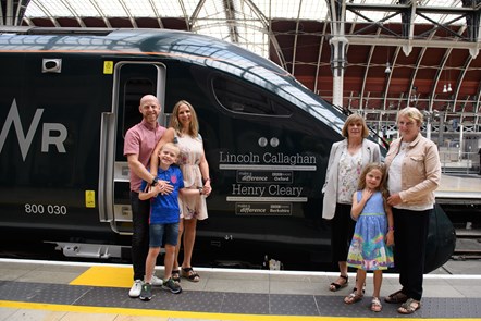 BBC Make A Difference Superstar Henry Cleary, eight, has become the youngest to have his name on the side of a train. He is pictured with members of his family including mum Emily and dad Jamie