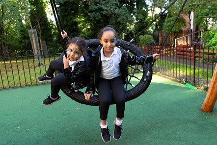 Holly Park Estate playground - girls on swing