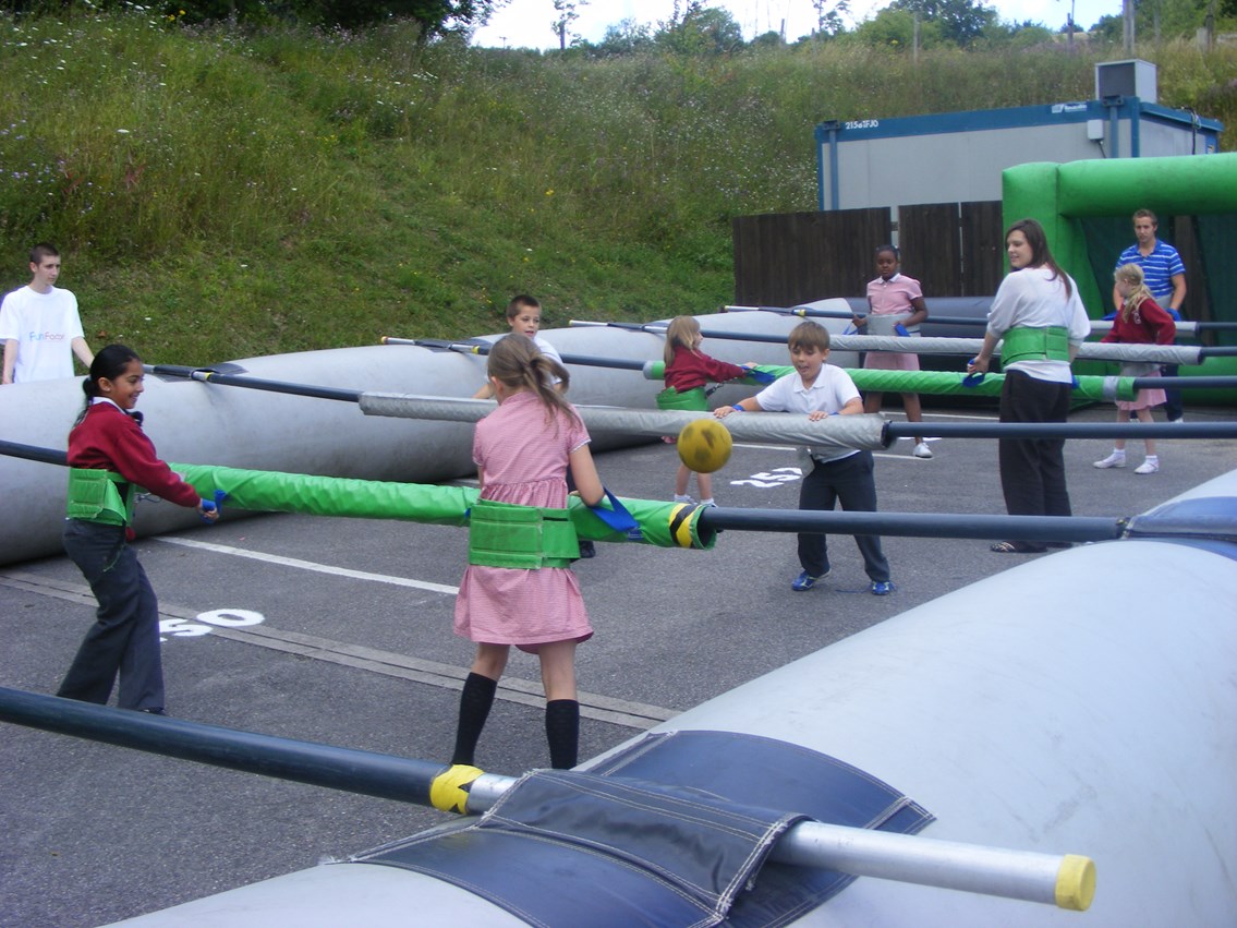 Kids playing giant table football: A group of Wycombe schoolchildren play a game of giant table football.