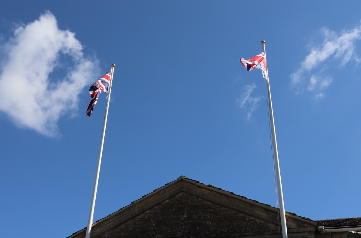 Armed Forces Day flag flying next to the Union Jack flag