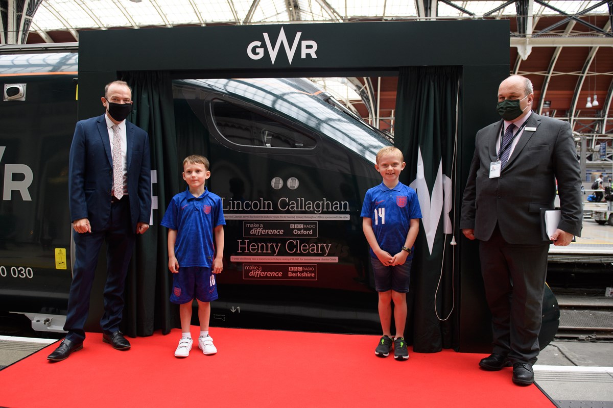 BBC Make A Difference Superstars Henry Cleary, eight, right, and Lincoln Callaghan, six, have become the youngest to have their names on the side of a train. They are pictured with Rail Minister Chris Heaton-Harris, left, and GWR managing director Mark Hopwood