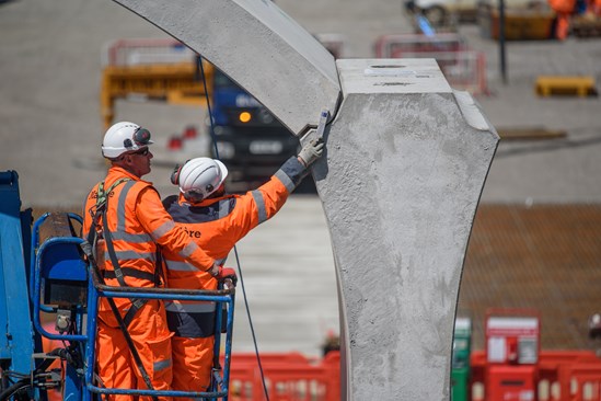 Workers inspect some of the first segments on the Chipping Warden green tunnel May 2022