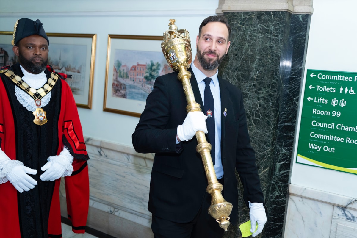 Mayor of Islington, Cllr Jason Jackson walking alongside the Mace-bearer