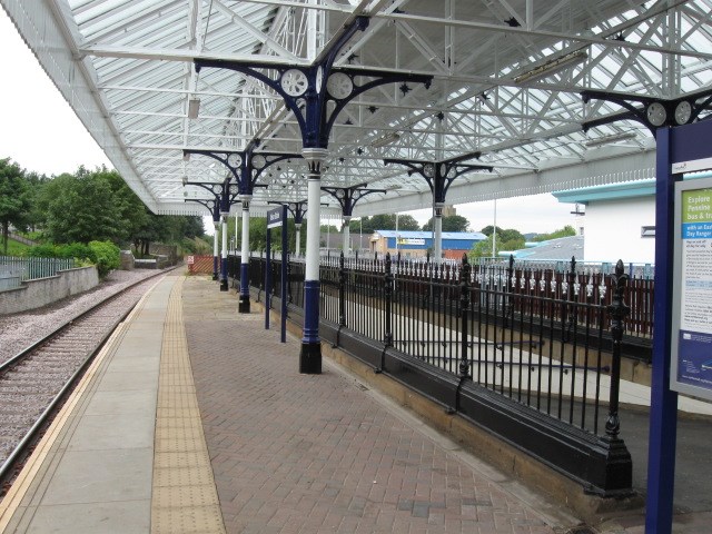 Subway railings (after): Railings surrounding the slope up to the platform.