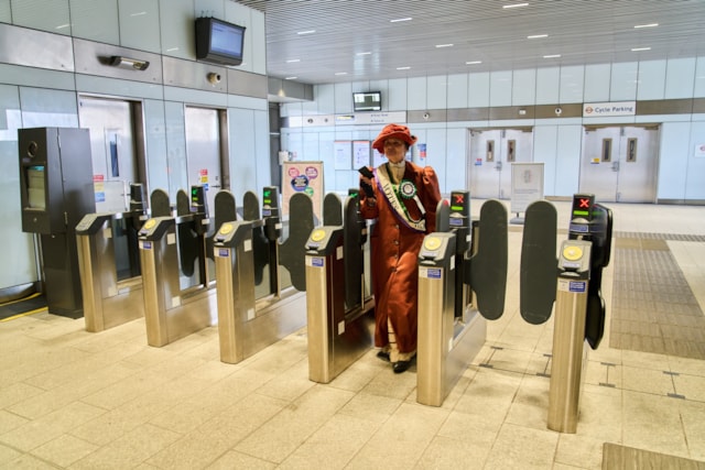 TfL Image - London Overground customers treated to a surprise as an actress dressed as Suffragette leader, Emmeline Pankhurst joined them on what will become the Suffragette line