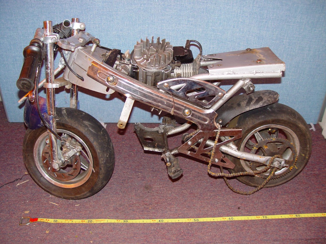 Motorcycle thrown onto the railway at Bulls Bridge: A mini-motorcycle which was thrown onto an Arriva Trains Wales service at Bulls Bridge, Shrewsbury on 7 August 2006