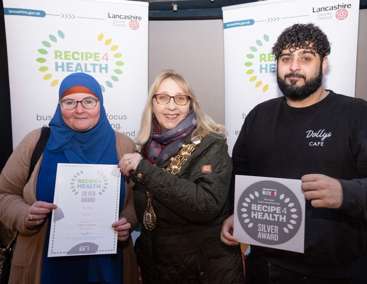 Dolly's staff are presented with the Silver award by the Mayor.