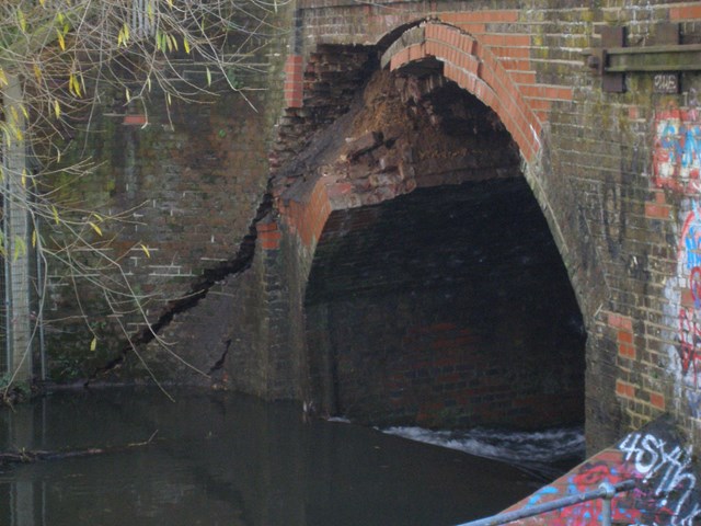 River Crane Bridge, nr Feltham: The main arch of the bridge was damaged after prolonged and intense rainfall caused the River Crane to swell.