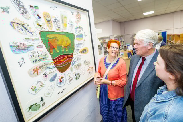 Threads of Nairn stitchers group and Cllr Ian Brown Burghead Bull tapestry