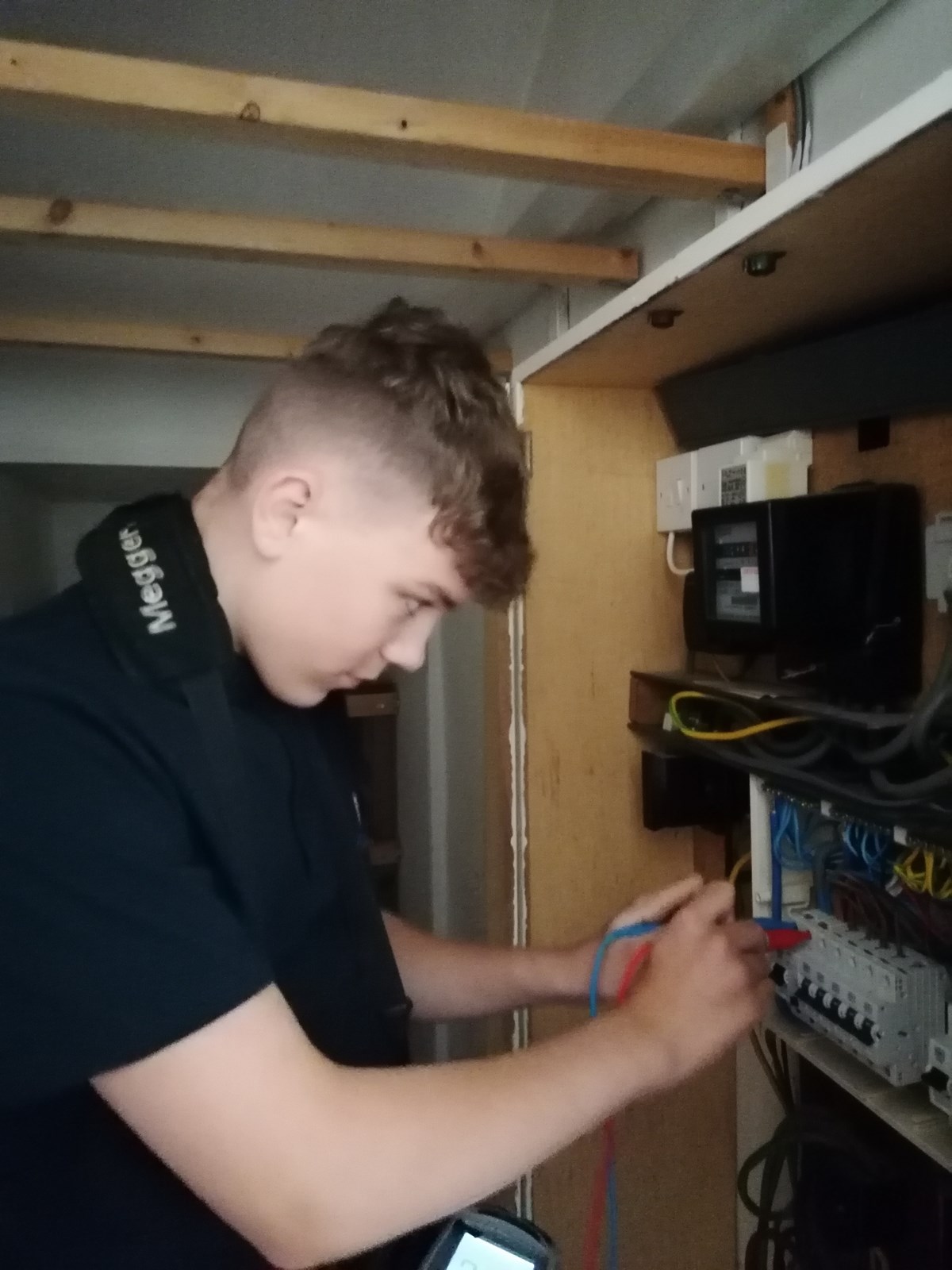 Modern Apprentice Electrician  Ross Neely: Modern Apprentice Ross Neely tests a circuit board