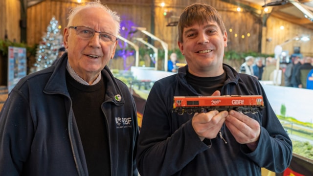 Pete Waterman gets a little inspiration: Andrew Willsher and Pete Waterman OBE with the model Inspiration Credit Railway 200 Credit Railway 200 (1)