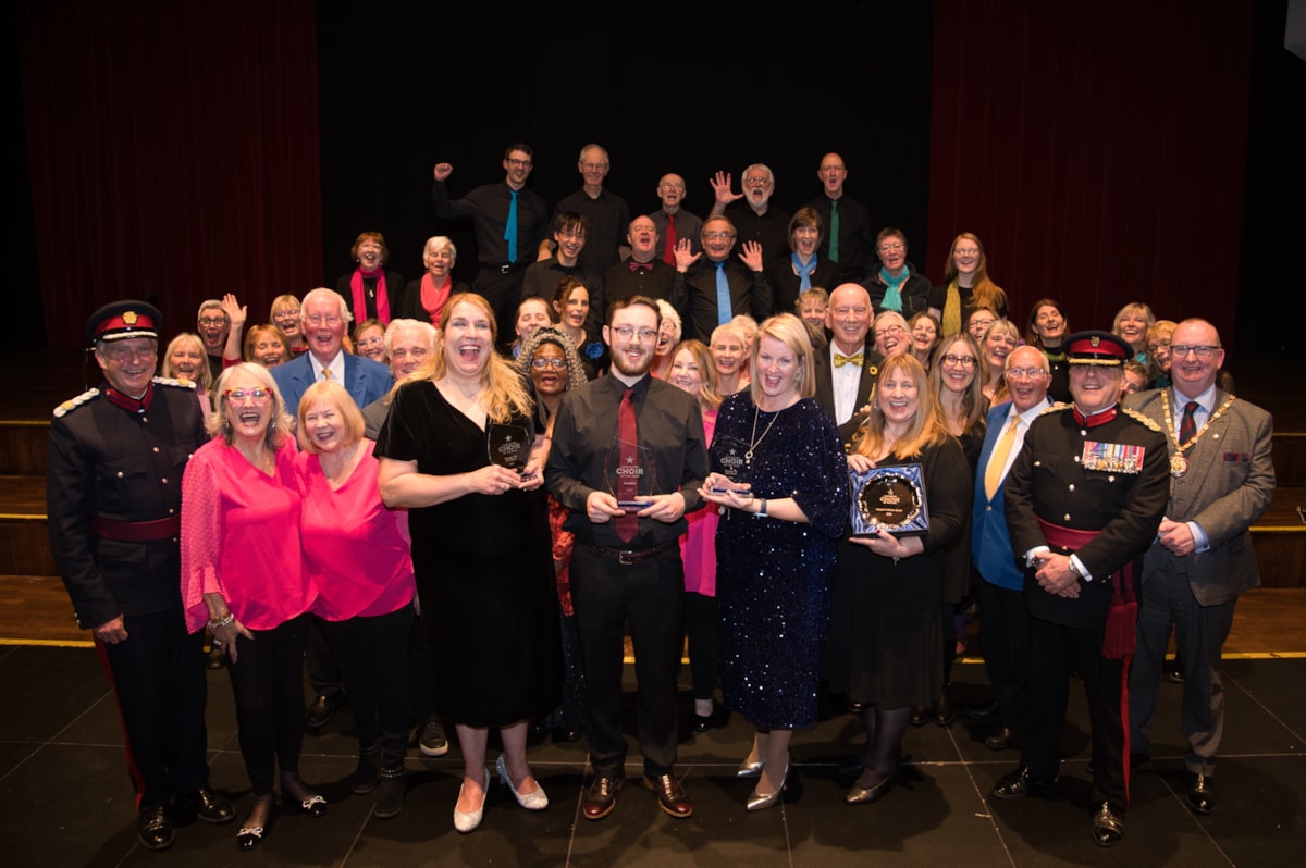 The musical directors of all the winning choirs collecting their awards onstage