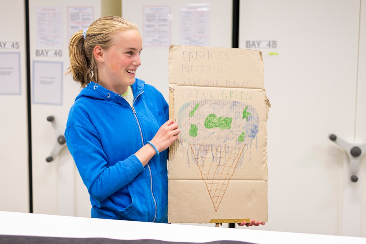 Bridget, aged 14, with her School Strike for Climate placard at the National Museums Colletion Centre. Photo (c) Duncan McGlynn (2)