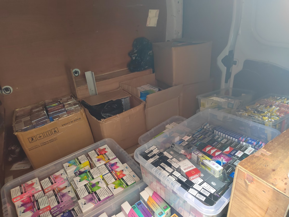 illegal tobbaco and vapes stored in a white business van