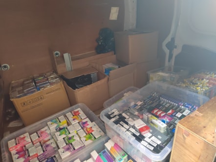 illegal tobbaco and vapes stored in a white business van