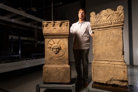Curator Dr Fraser Hunter examines the Roman altars.Photo © Duncan McGlynn (2)