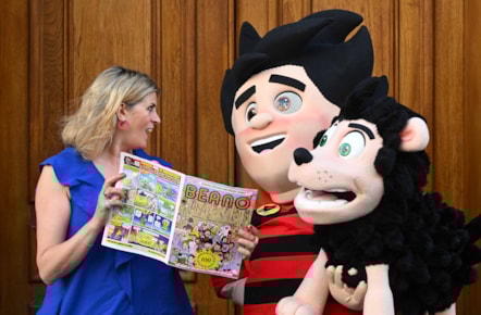 National Librarian and Chief Executive of the National Library of Scotland, Amina Shah holds the special centenary edition of Beano alongside Dennis the Menace, outside the library's George IV Bridge building in Edinburgh. Credit: Neil Hanna