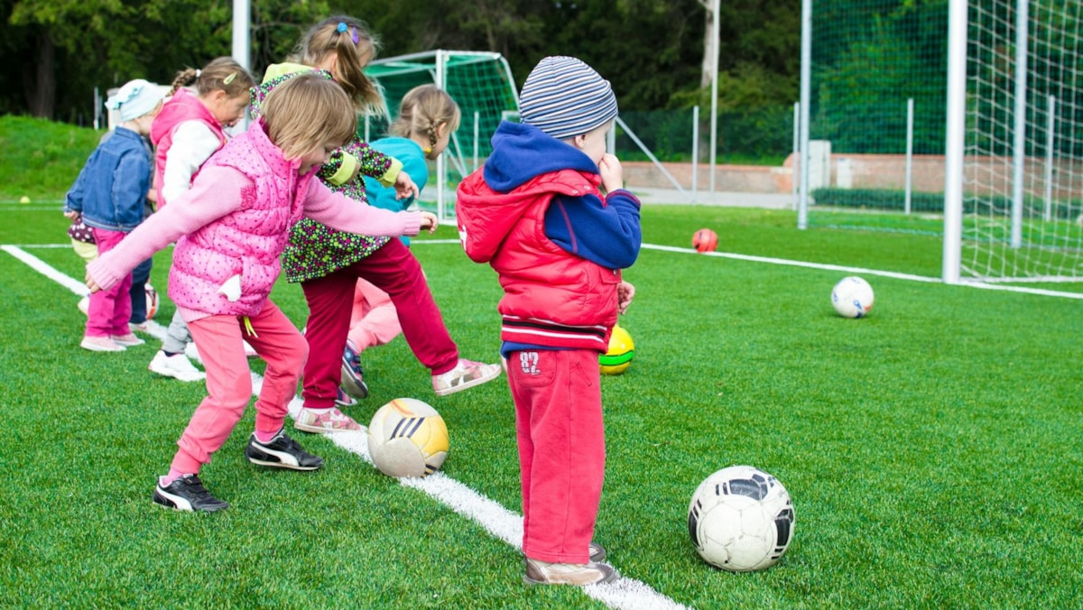 Children playing football cropped