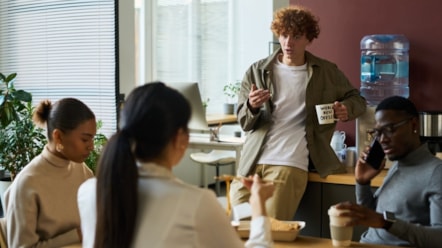 Image shows office workers in discussion