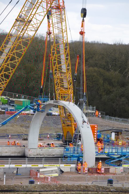 Tandem lift during test installation of the first arches at the Bat Protection Structure March 2025