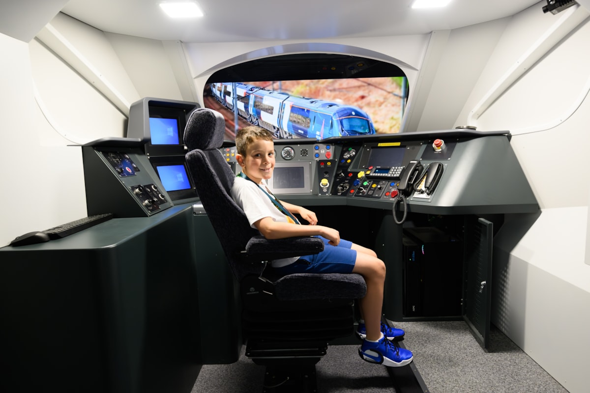 Joshua Emmett, 11, takes a seat in Pendolino simulator as part of train driver experience with Avanti West Coast