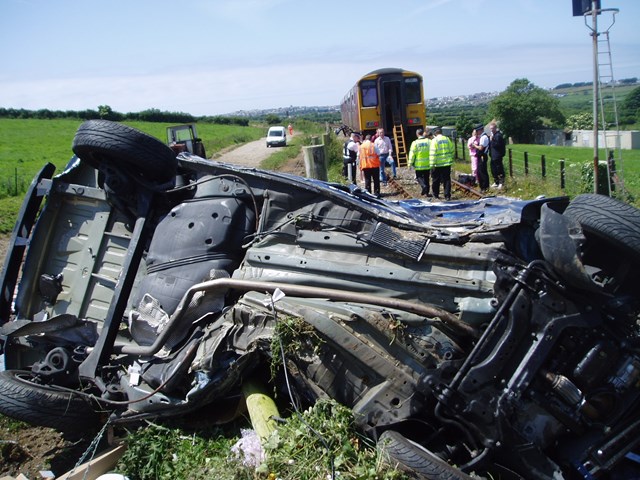 Car severely damaged after collision with train in Cornwall